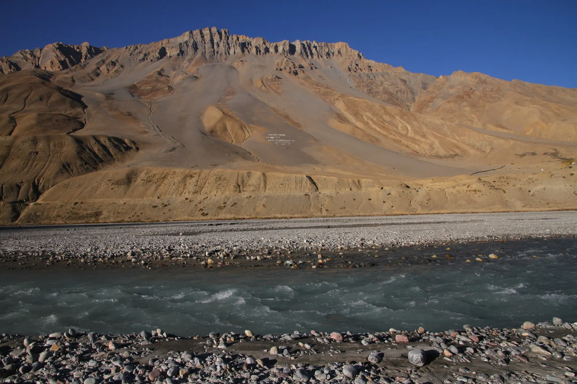 Spiti river and bare golden hills at Kaza